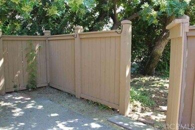 Spacious, fenced backyard, with a gate that opens 