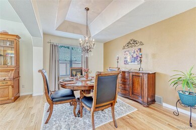 Formal dining room with tray ceiling, elegant chan