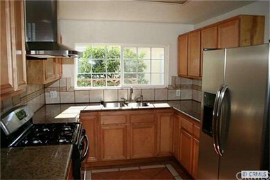 Remodeled kitchen with newer cabinets, granite cou