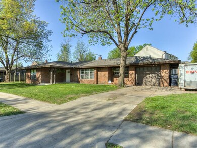 View of front facade with an attached garage, a ch