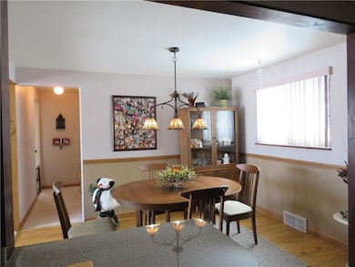 View from the bar area in kitchen, chair rail and 