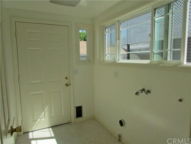 Separate laundry room finished to perfection.