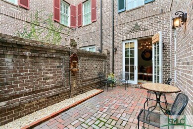 Tranquil side courtyard with low maintenance brick