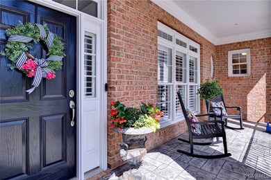 Enjoy your morning coffee on the wrought iron and stamped concrete front porch.