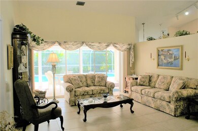 Formal living area with triple glass sliders overl