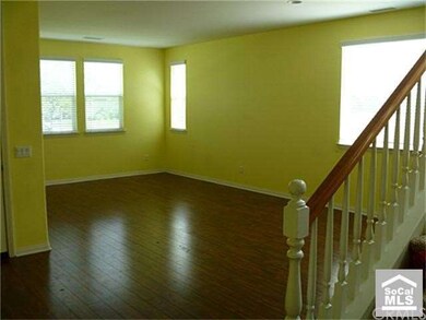 Big & bright living room at front entry of house.