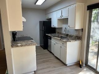 Kitchen has adequate cabinet storage, granite counter tops and easy access.