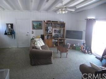 View of den from step-down.  Sliding door to rear 
