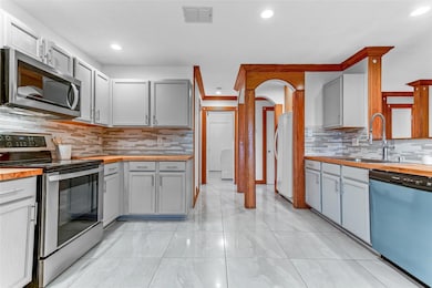 Kitchen with appliances with stainless steel finis