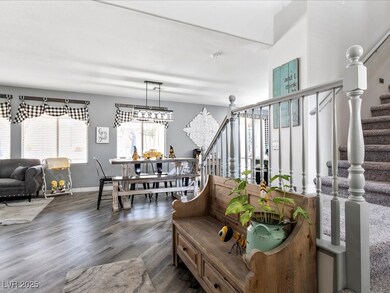 Living area featuring stairs, wood finished floors