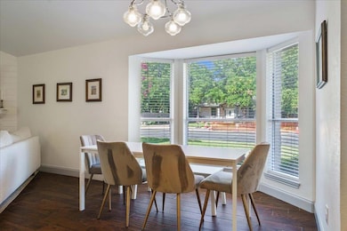 Dining room with plenty of natural light, a chand
