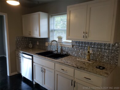 Kitchen cabinets and granite counters are in good