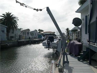 Waterfront/Dock/Pier. Cement seawall with davits.