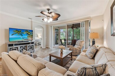 Living area with baseboards, ornamental molding, a