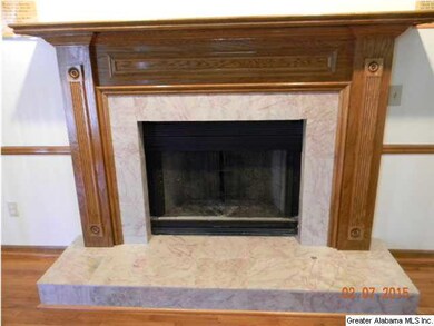 FIREPLACE WITH MARBLE AND A BEAUTIFUL WOOD GRAIN M