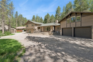 Featuring an attached two car garage with bonus room above