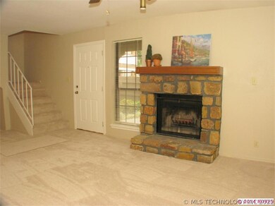 Living room with new carpet and fireplace