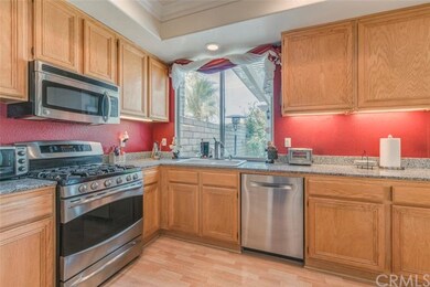 Kitchen Overlooks Lush Yard.