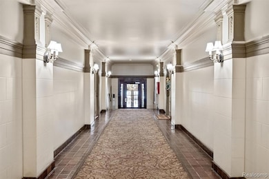 Hallway featuring crown molding