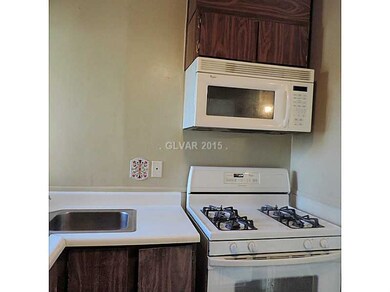 Property Photo. Kitchen w. gas stove and micrtowav