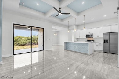Kitchen with stainless steel appliances, baseboard