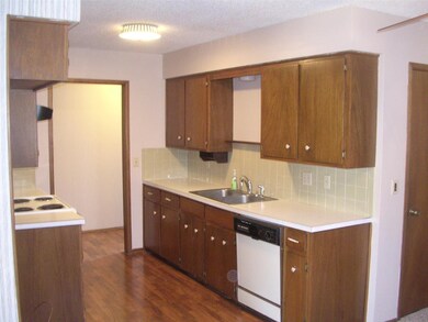 Kitchen w/ Wood Laminate Flooring