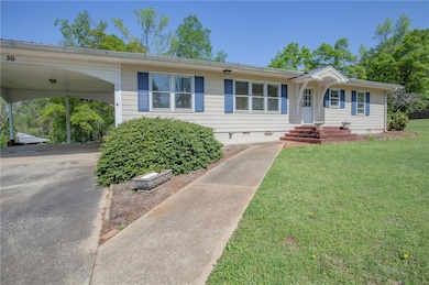 Single story home with a front lawn, crawl space, 