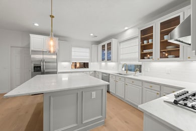 Above the Kitchen island, hang Edison-style lighting of exceptional quality and design.