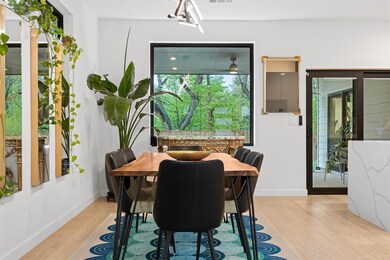 Dining room featuring visible vents, light wood f