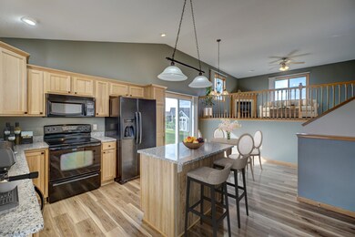 Breakfast bar area boasts ranite counter-tops on center island