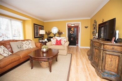 Living room w/ newer flooring and paint.