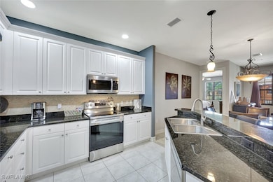 Kitchen with appliances with stainless steel finis