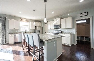 GOURMET KITCHEN INCLUDES: HARDOOD FLOORS, GRANITE TOPS, GAS STOVE, SS APPLIANCES AND A LARGE WALK-IN PANTRY.