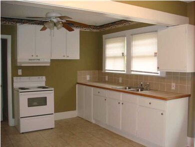 The huge kitchen has ceramic tile flooring, cerami