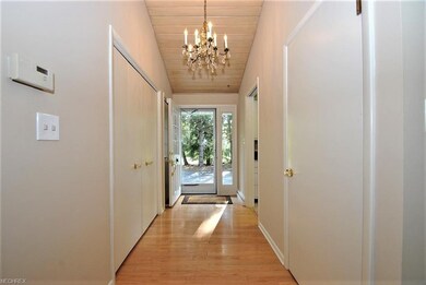 Bright, inviting foyer with hardwood floors greets