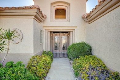 Doorway to property with stucco siding and a tiled