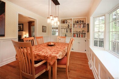 DINING ROOM WITH BUILT-INS AND WINDOW SEAT