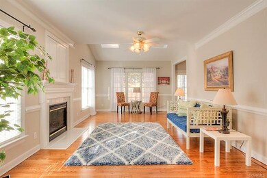 Family Room w/ gas fireplace and skylights