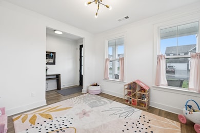 A charming overhead fixture adds a touch of character to the versatile space. 3534 Madrid Way Murfreesboro, TN 37129