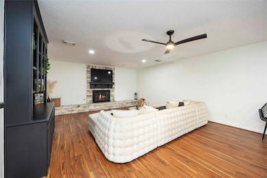 Spacious living room featuring accent walls around
