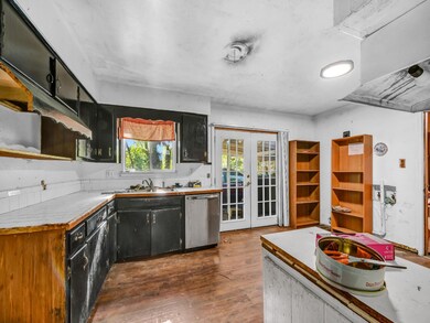 Kitchen featuring french doors to back yard, and s
