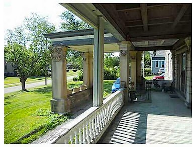 Exquisitely Detailed Covered Wrap Around Porch and