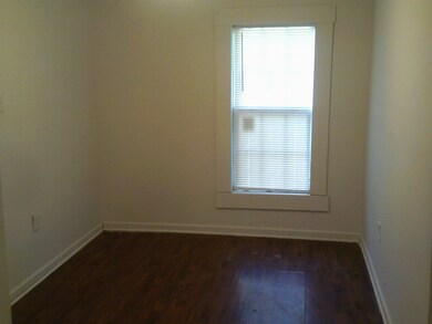 Spare room featuring hardwood / wood-style floorin