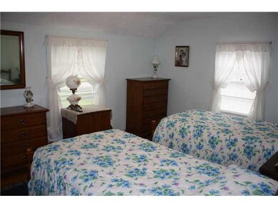 Bedroom. Bedroom #1 with light blue walls and wind