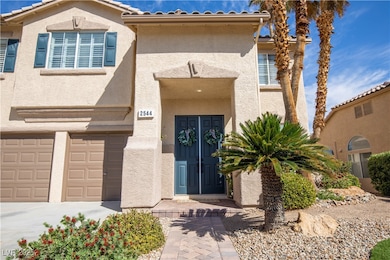 Entrance to property featuring stucco siding, a ti