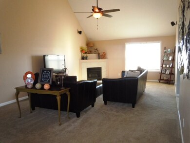 Features extra tall vaulted ceiling and corner fir