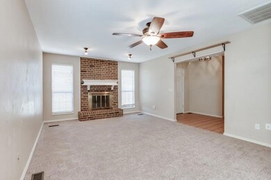 Unfurnished living room featuring ceiling fan, lig