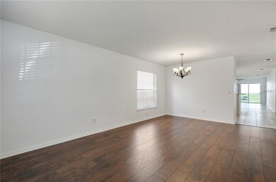 View to back yard from formal living/formal dining area...