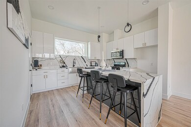 The stylish kitchen island doubles as a breakfast