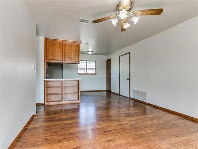 Unfurnished living room featuring hardwood / wood-